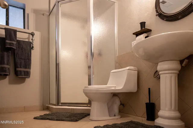 a view of backyard of house and car parked