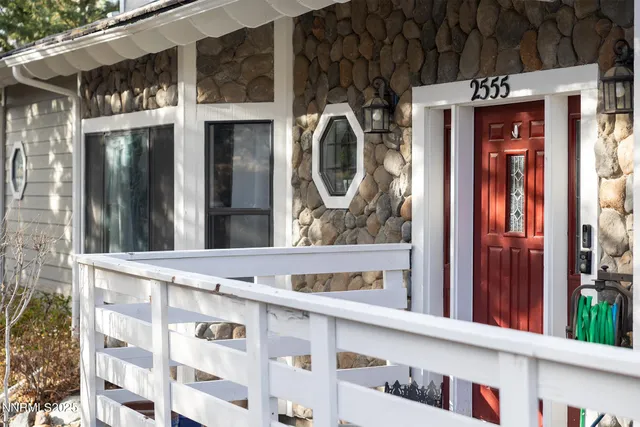a bathroom with a toilet a sink and a mirror