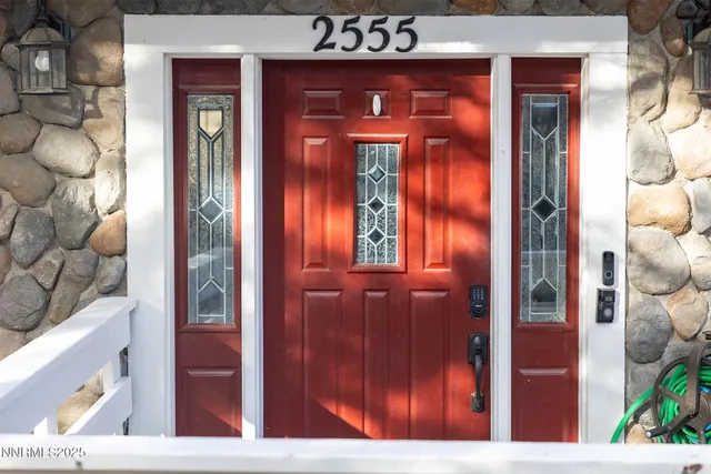 a kitchen with lots of wooden cabinets and outdoor seating