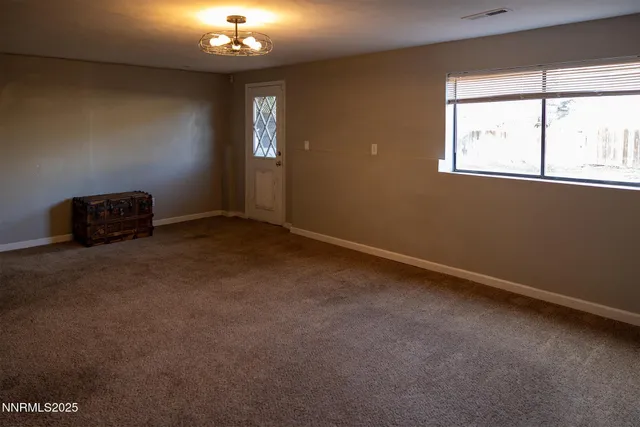 a bedroom with a bed and dresser