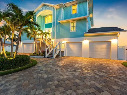 a view of a swimming pool with an outdoor seating