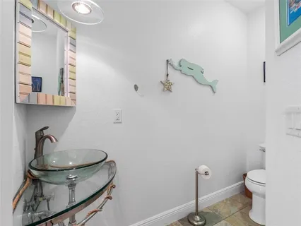 a view of a balcony with lake view and wooden floor