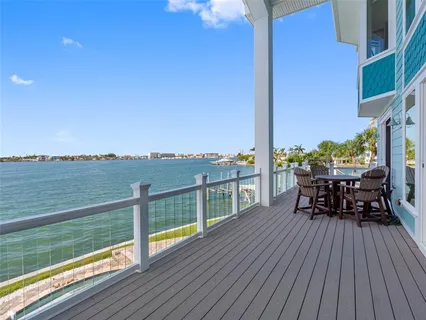 a spacious bathroom with a granite countertop sink and a mirror