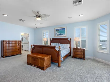an aerial view of a house with a ocean view