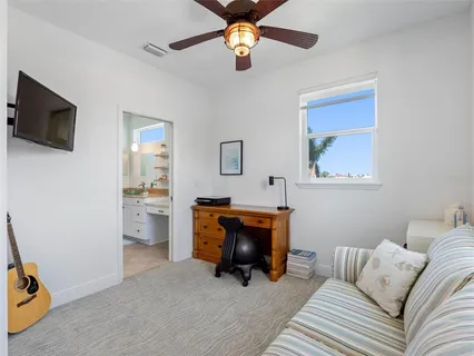 an aerial view of a house with a garden and lake view