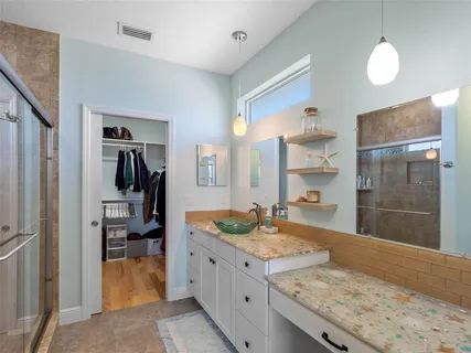 a front view of a house with a yard table and chairs