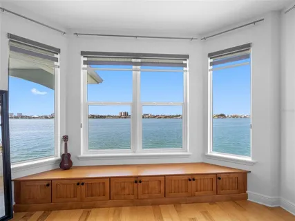 a view of a house with a yard and a lawn chair