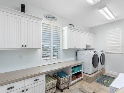 a view of a swimming pool with a table and chairs