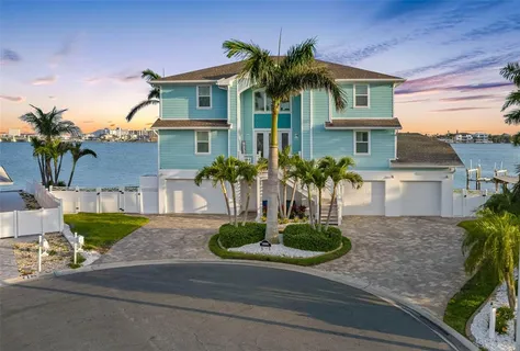 a kitchen with lots of counter top space sink and stainless steel appliances