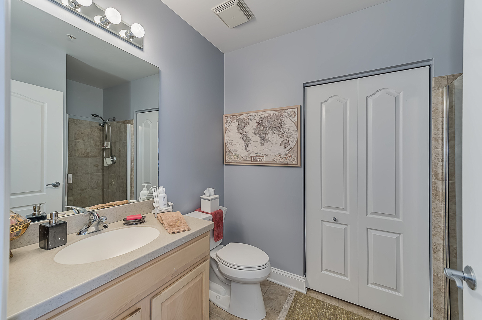 1 Itasca Place, Unit 501 Addison, IL 60143 - Photo 19 of 24 a bathroom with a sink vanity mirror and toilet