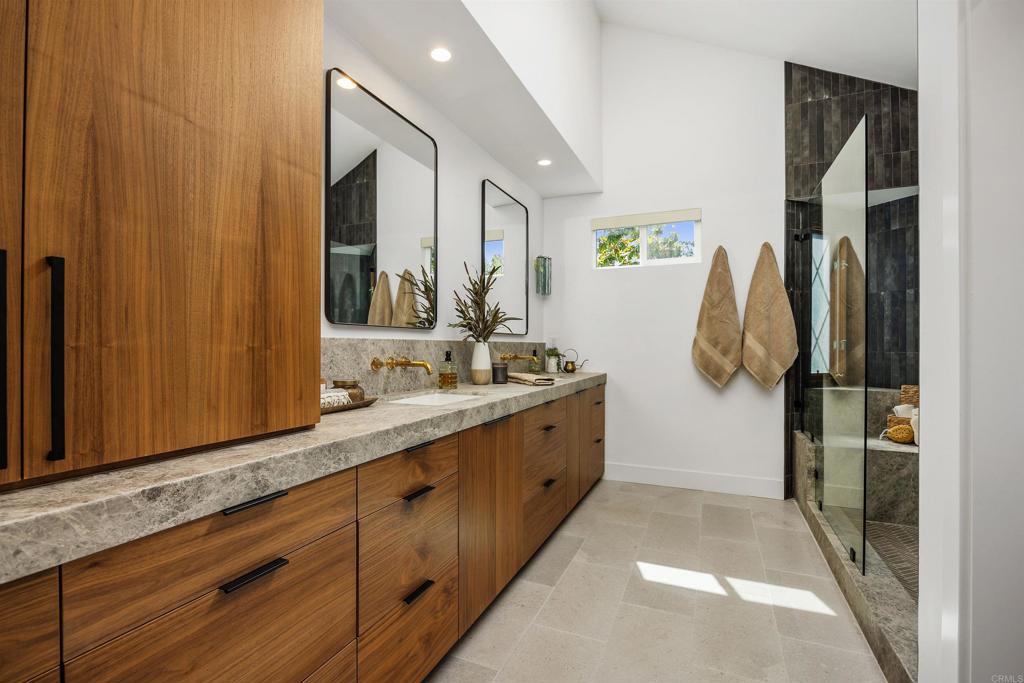 602 Sereno View Road Encinitas, CA 92024 - Photo 14 of 34 a bathroom with a double vanity sink and a mirror