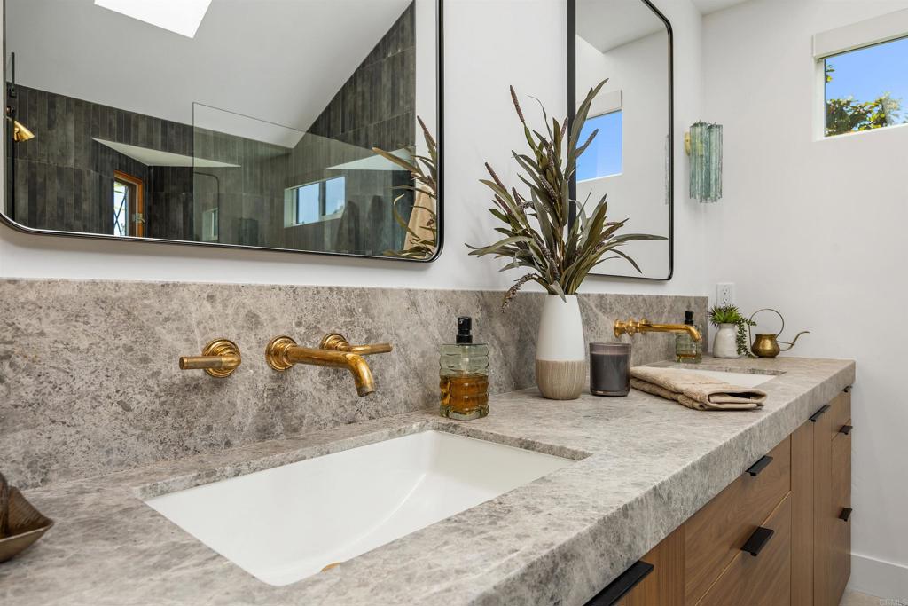 602 Sereno View Road Encinitas, CA 92024 - Photo 15 of 34 a bathroom with sink and mirror