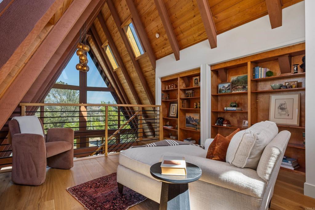 602 Sereno View Road Encinitas, CA 92024 - Photo 17 of 34 a living room with furniture a lamp and a large window