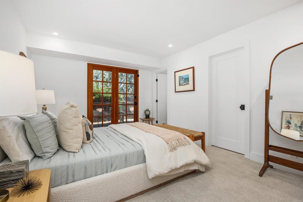 602 Sereno View Road Encinitas, CA 92024 - Photo 21 of 34 a bedroom with a bed and a window