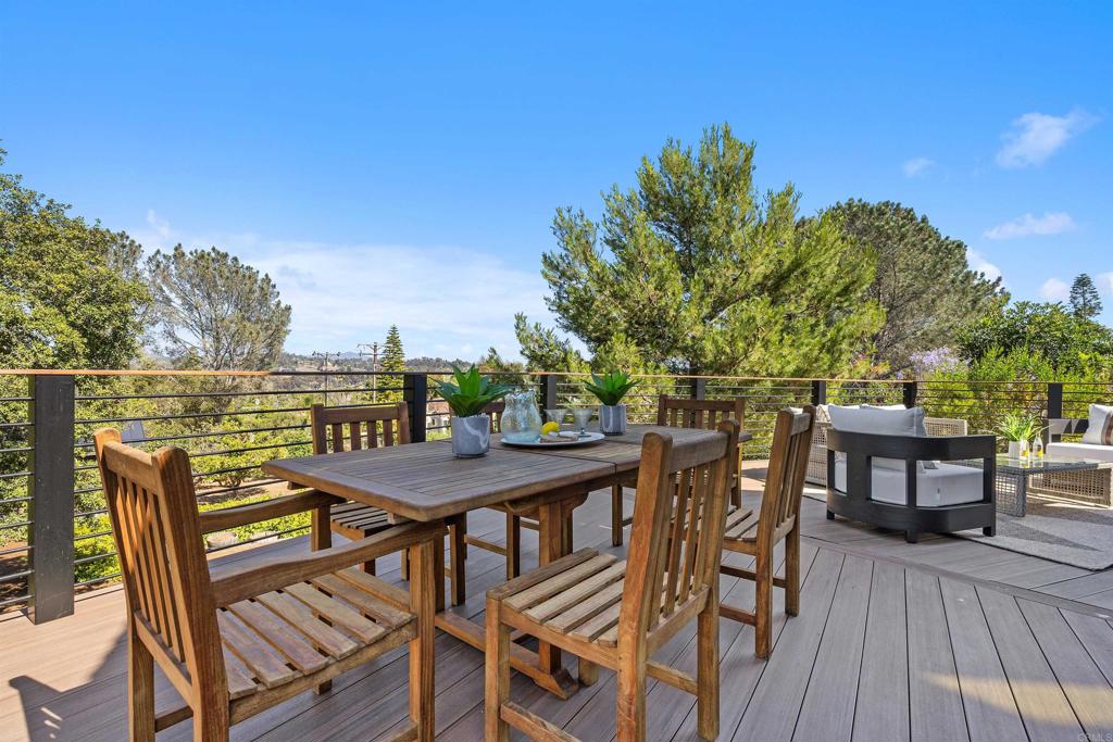 602 Sereno View Road Encinitas, CA 92024 - Photo 24 of 34 a balcony with wooden floor table and chairs