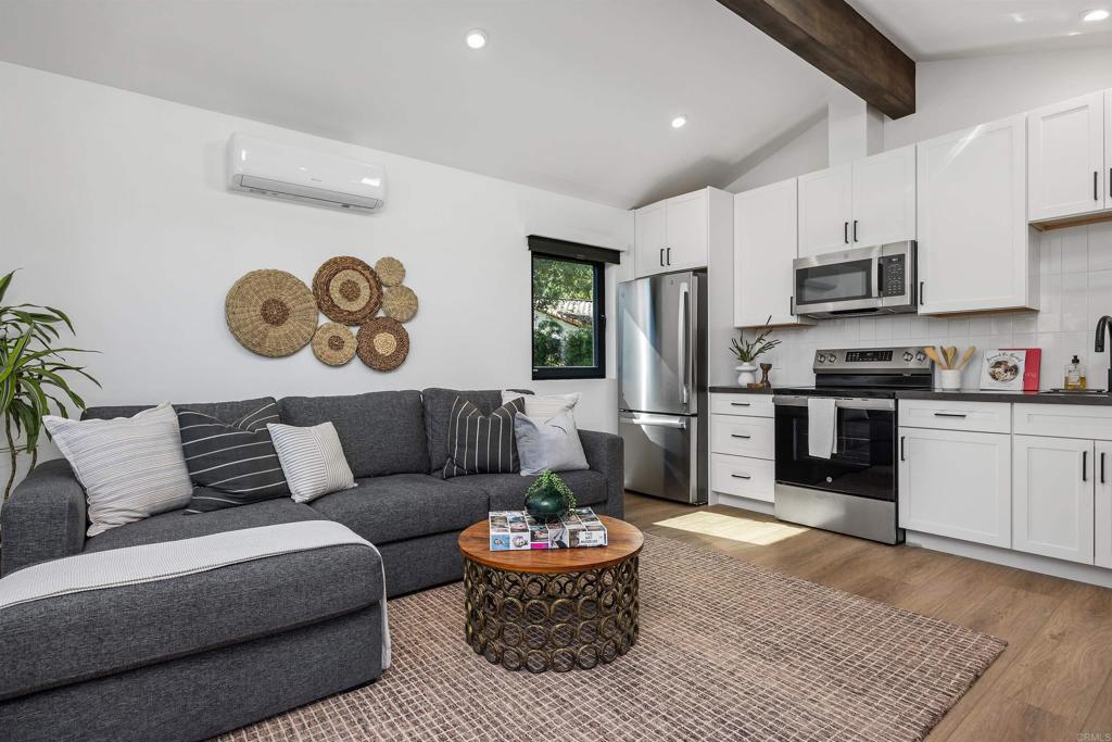 602 Sereno View Road Encinitas, CA 92024 - Photo 27 of 34 a living room with furniture and kitchen view