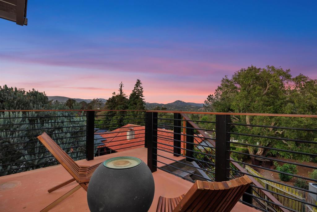 602 Sereno View Road Encinitas, CA 92024 - Photo 31 of 34 a view of a balcony with mountain view and wooden floor