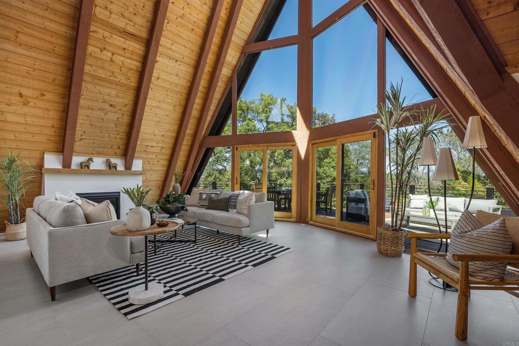 602 Sereno View Road Encinitas, CA 92024 - Photo 4 of 34 a living room with furniture and a floor to ceiling window