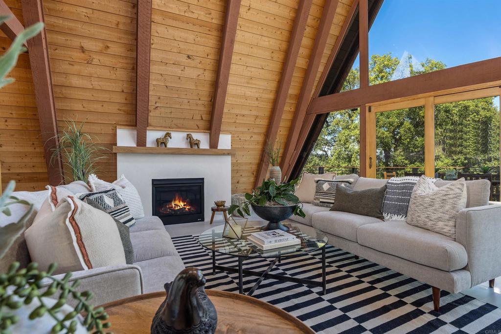 602 Sereno View Road Encinitas, CA 92024 - Photo 5 of 34 a living room with furniture fireplace and a large window