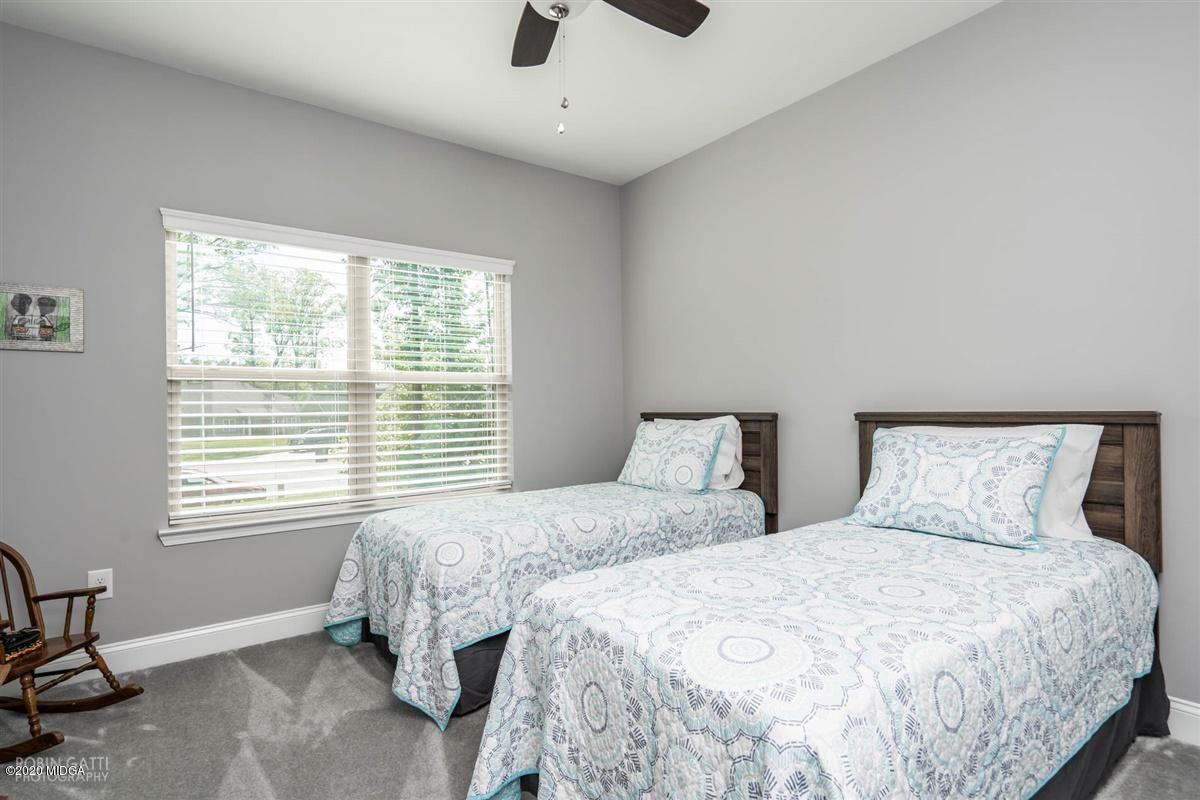 826 Holly Ridge Drive Gray, GA 31032 - Photo 20 of 28 a bedroom with two beds and a window