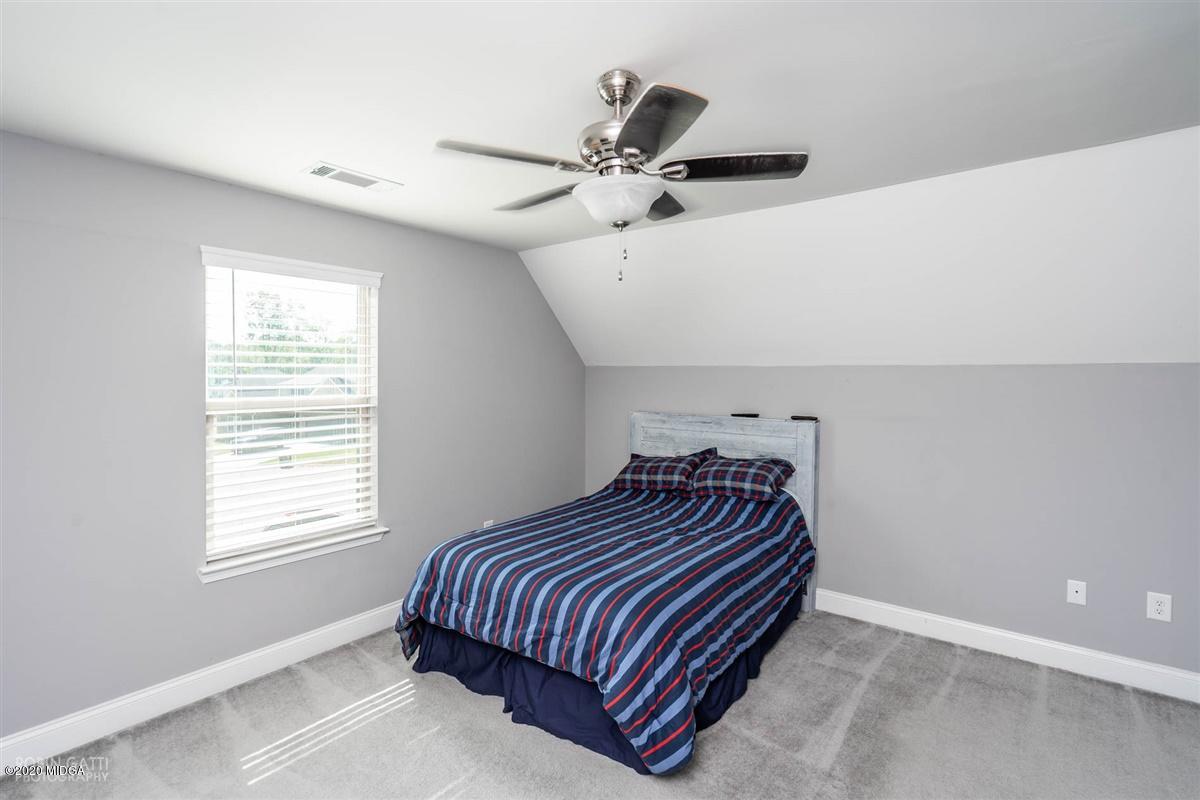 826 Holly Ridge Drive Gray, GA 31032 - Photo 24 of 28 a bedroom with bed and window