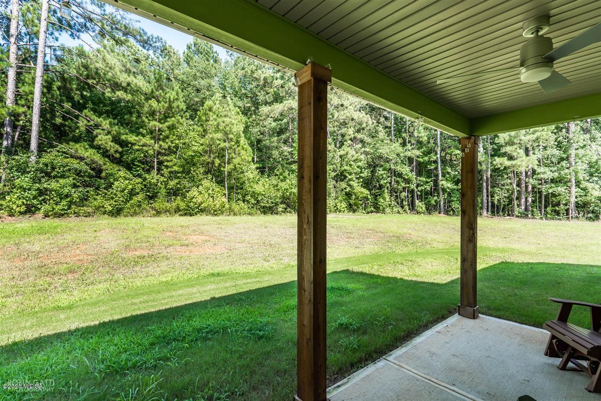 826 Holly Ridge Drive Gray, GA 31032 - Photo 26 of 28 a view of a garden and trees