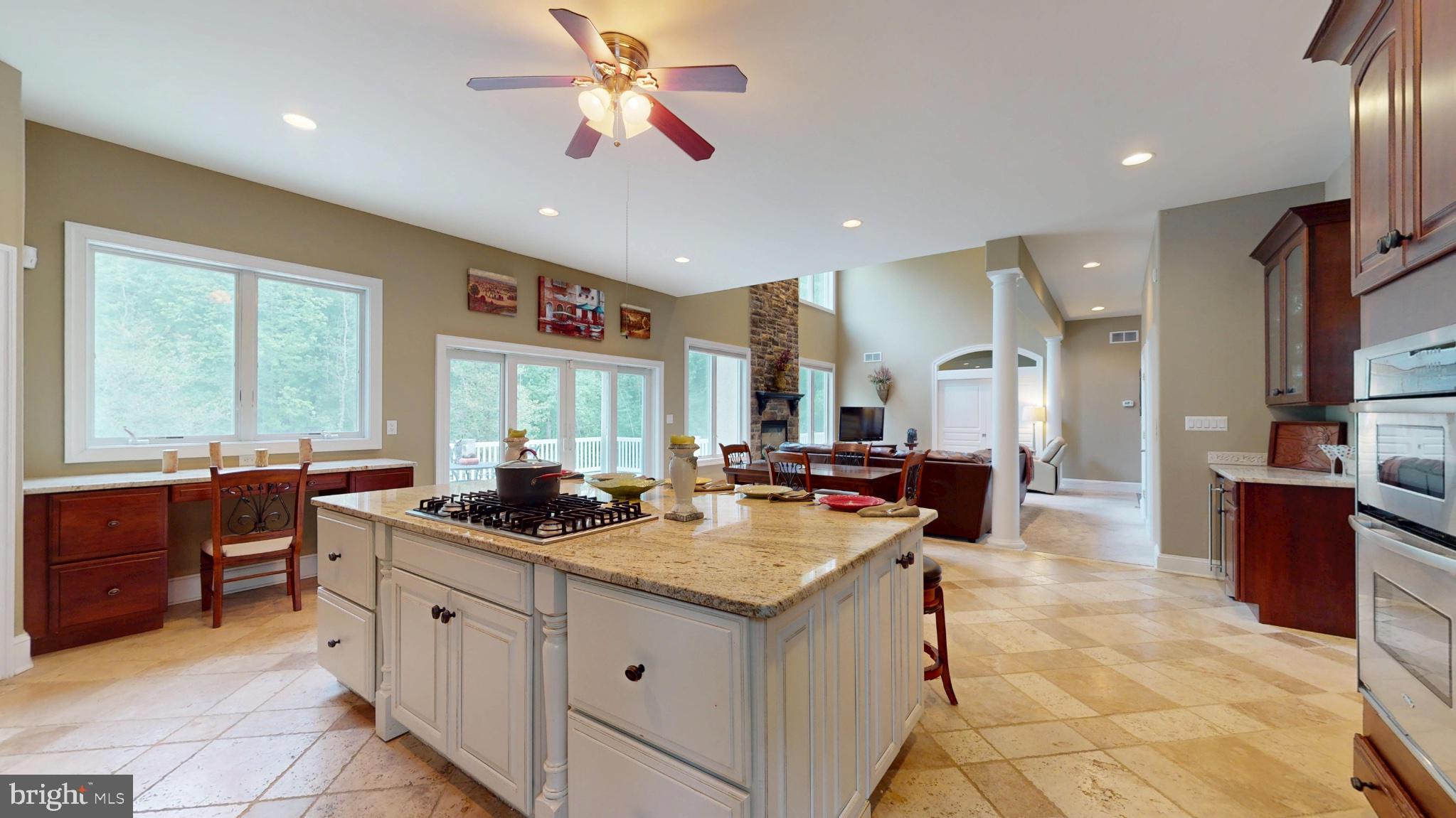 309 Ark Road Mount Laurel, NJ 08054 - Photo 11 of 60 a kitchen with a stove a sink a counter space and living room view