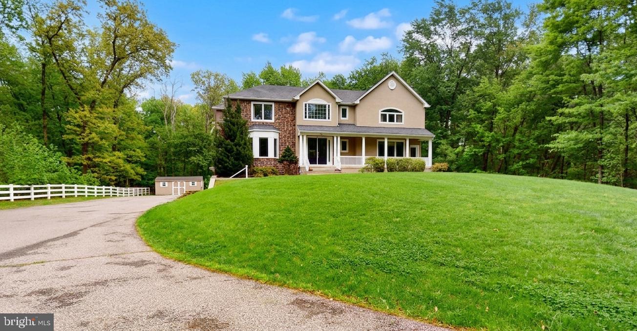309 Ark Road Mount Laurel, NJ 08054 - Photo 2 of 60 a front view of a house with a garden