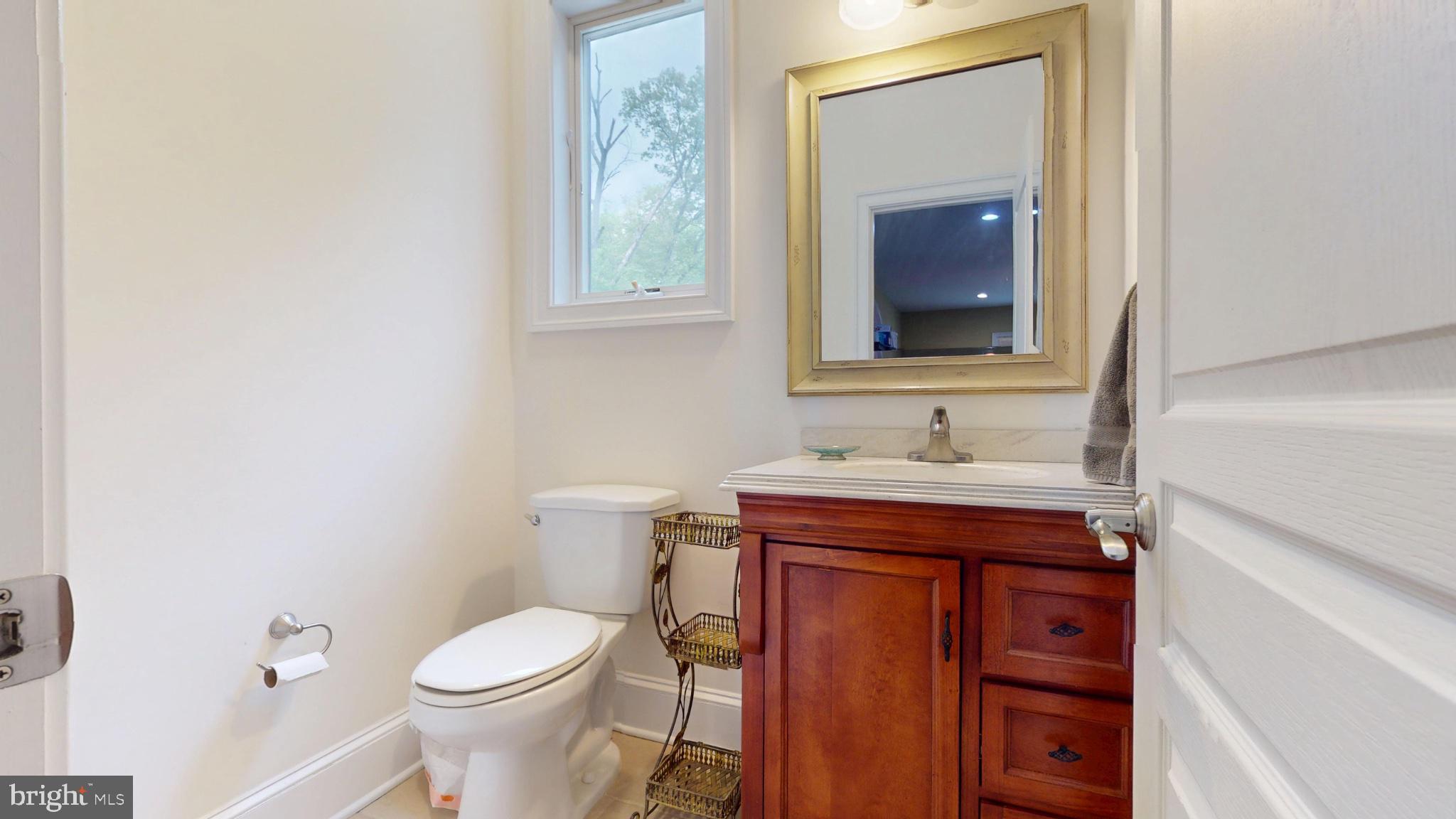 309 Ark Road Mount Laurel, NJ 08054 - Photo 23 of 60 a bathroom with a sink and a toilet