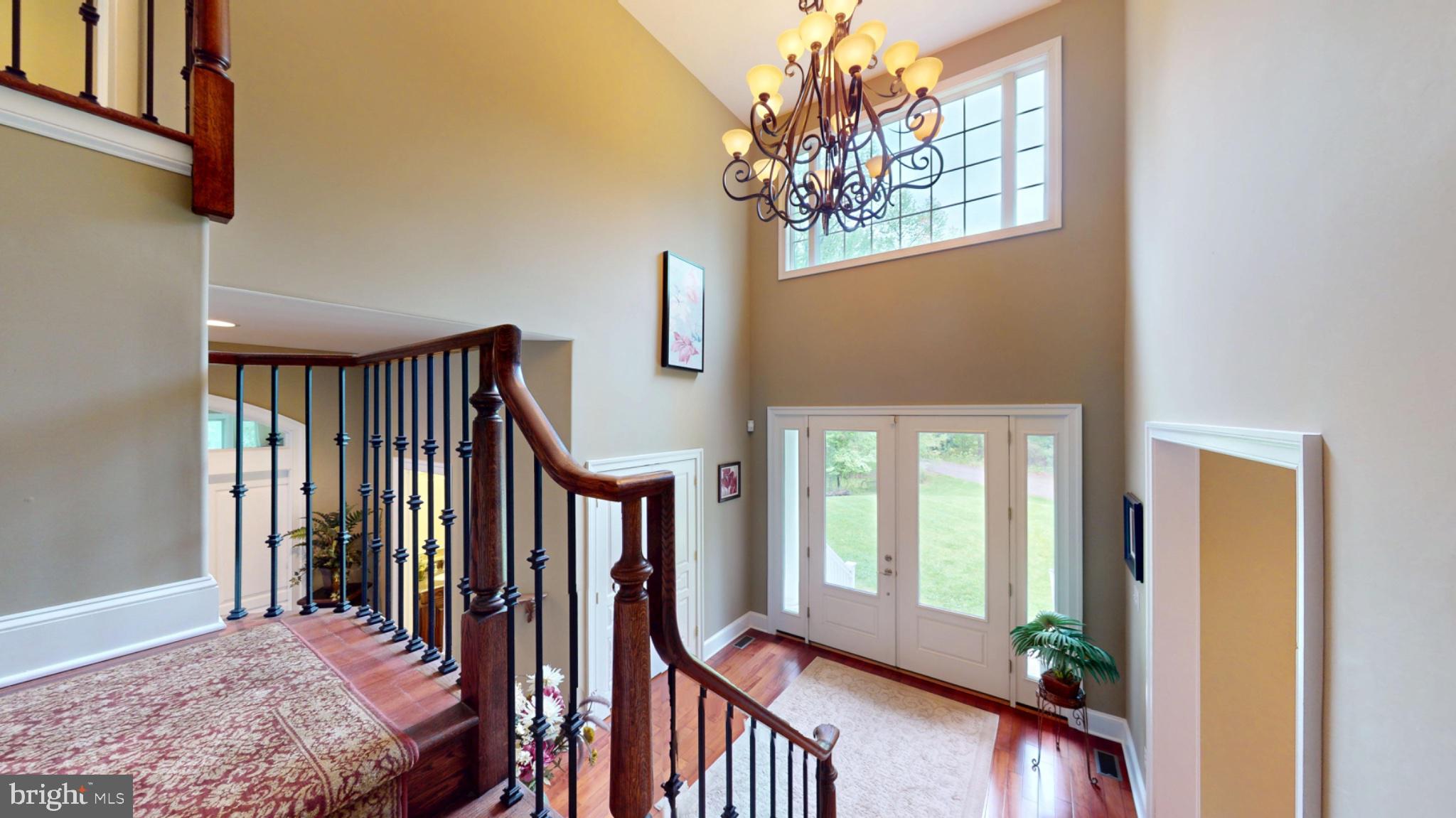 309 Ark Road Mount Laurel, NJ 08054 - Photo 24 of 60 a bedroom with a large bed and a chandelier