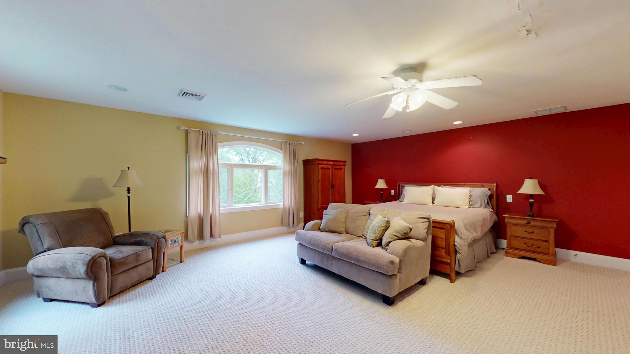 309 Ark Road Mount Laurel, NJ 08054 - Photo 28 of 60 a spacious bedroom with a bed couch and window