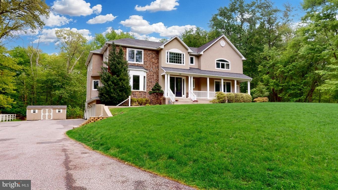 309 Ark Road Mount Laurel, NJ 08054 - Photo 3 of 60 a front view of a house with a yard