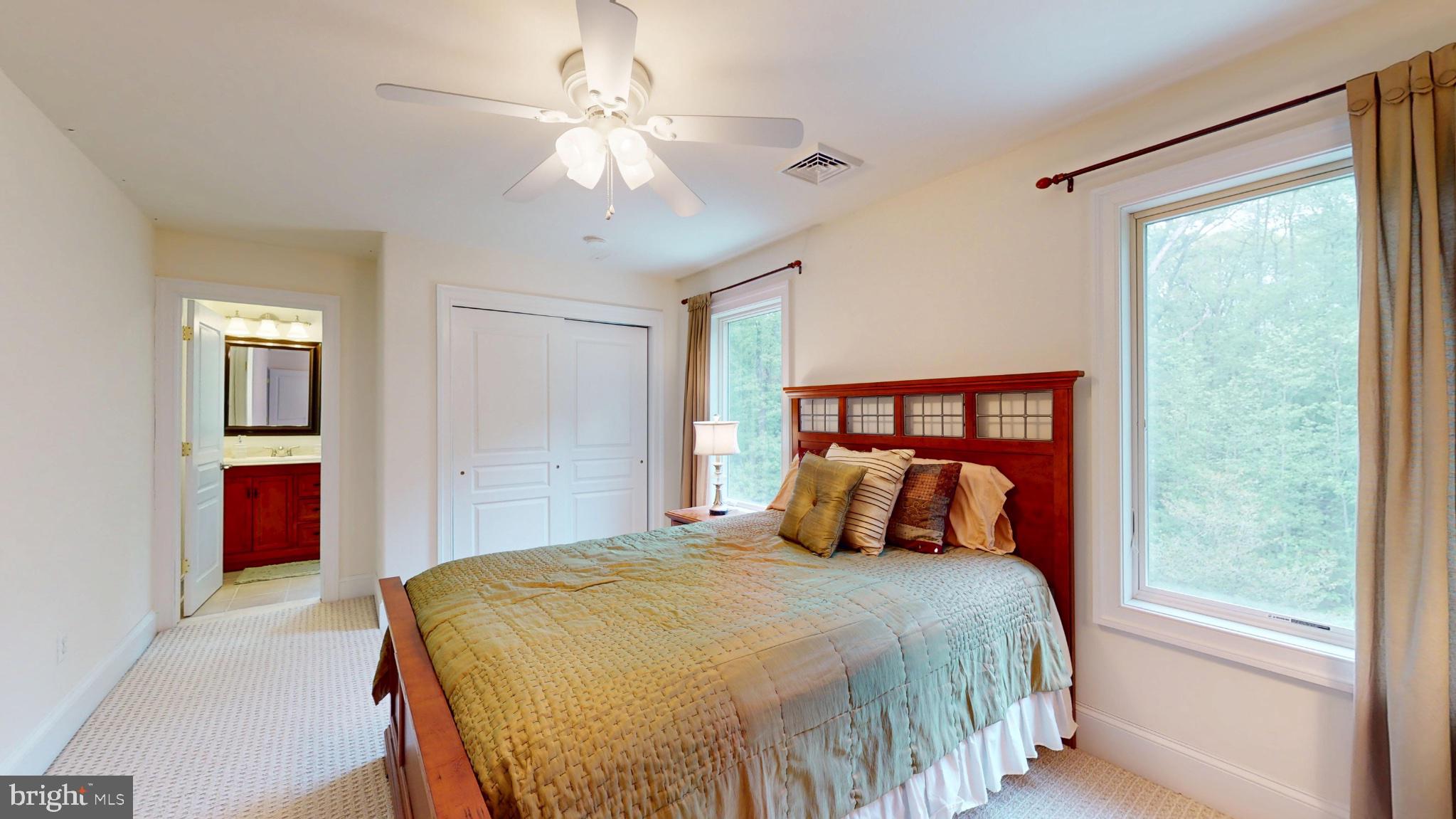 309 Ark Road Mount Laurel, NJ 08054 - Photo 37 of 60 a bedroom with a large bed and a chandelier
