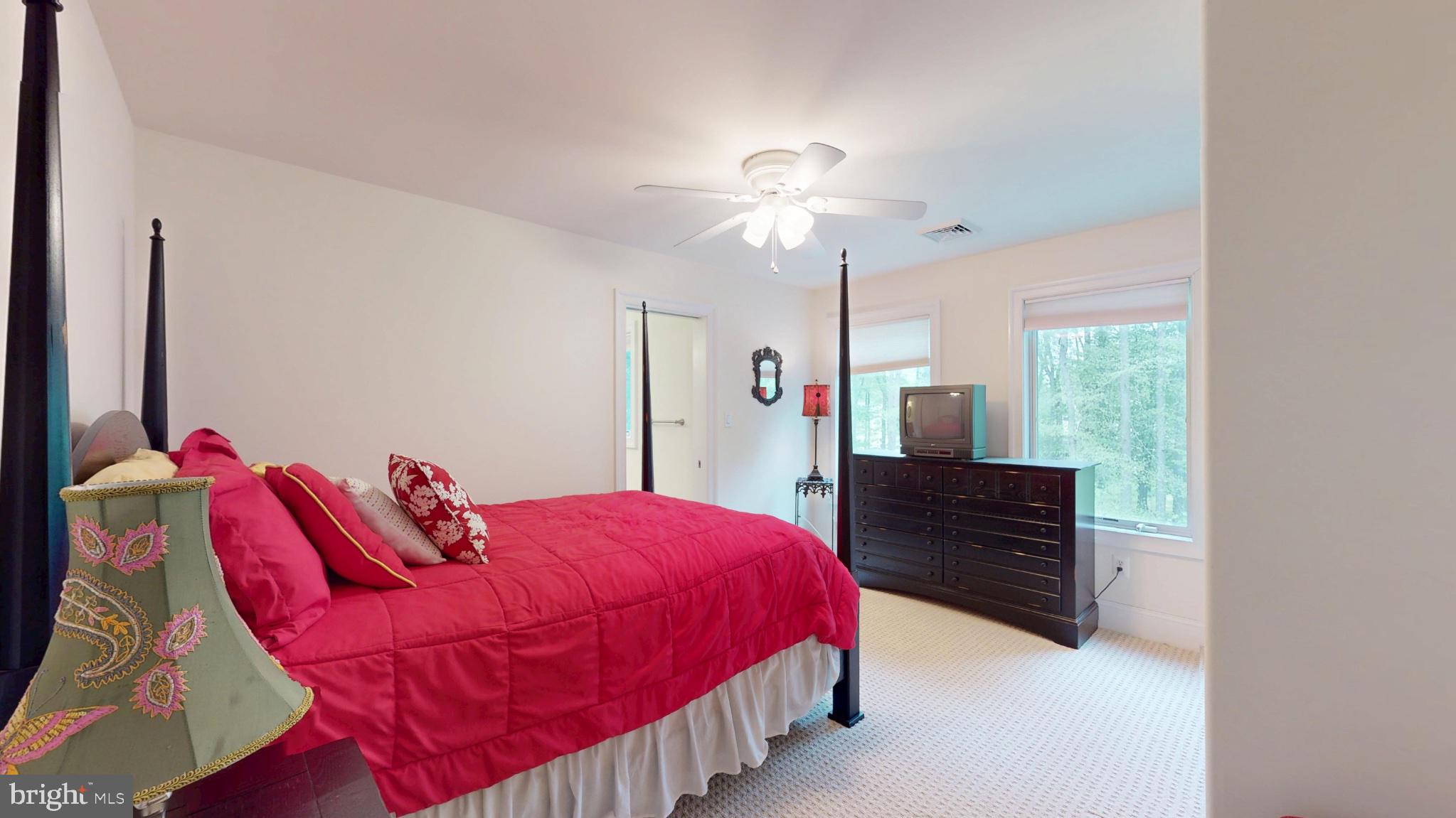 309 Ark Road Mount Laurel, NJ 08054 - Photo 40 of 60 a bedroom with a bed and a chandelier