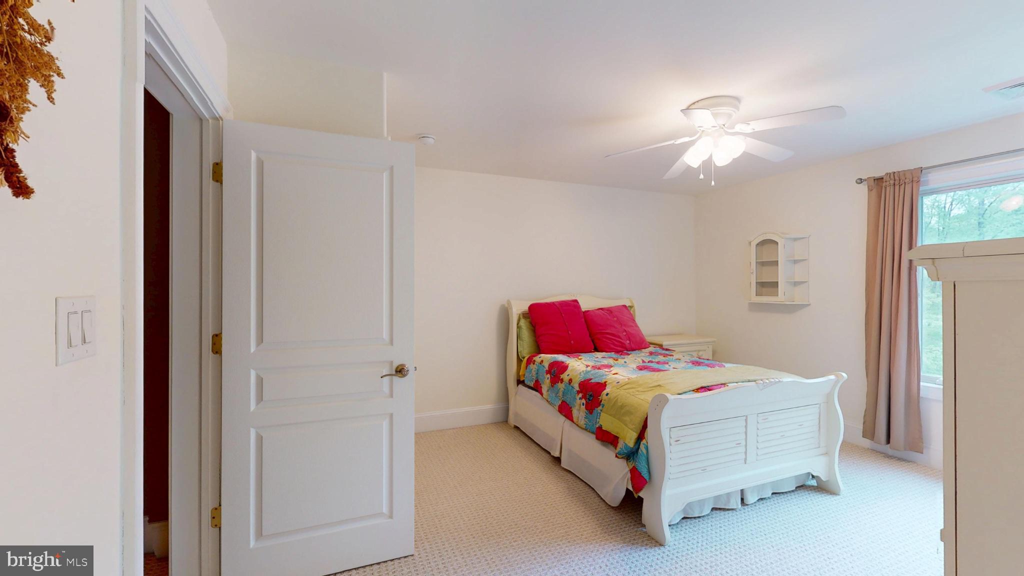 309 Ark Road Mount Laurel, NJ 08054 - Photo 42 of 60 a bedroom with a bed and a chandelier