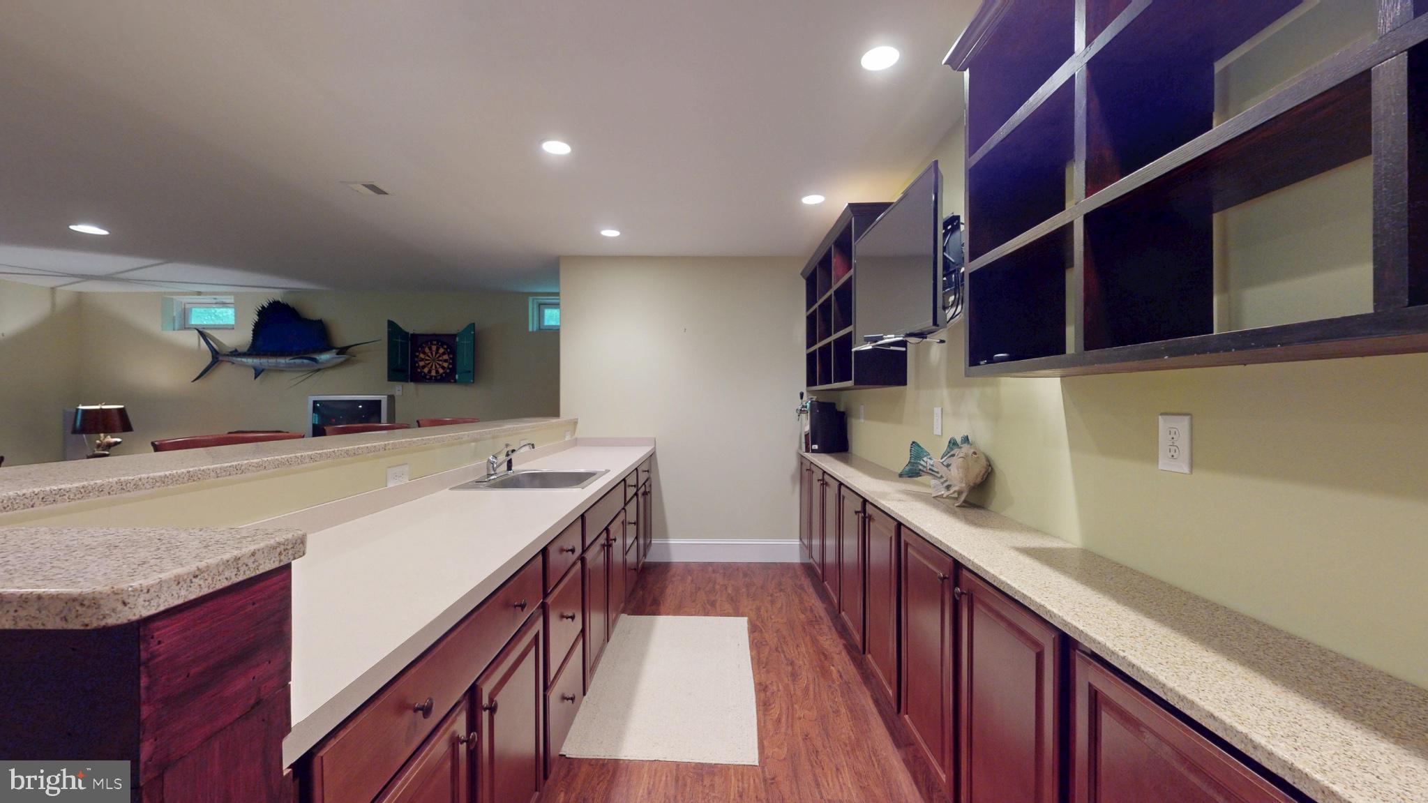309 Ark Road Mount Laurel, NJ 08054 - Photo 46 of 60 a kitchen with a sink and wooden cabinets