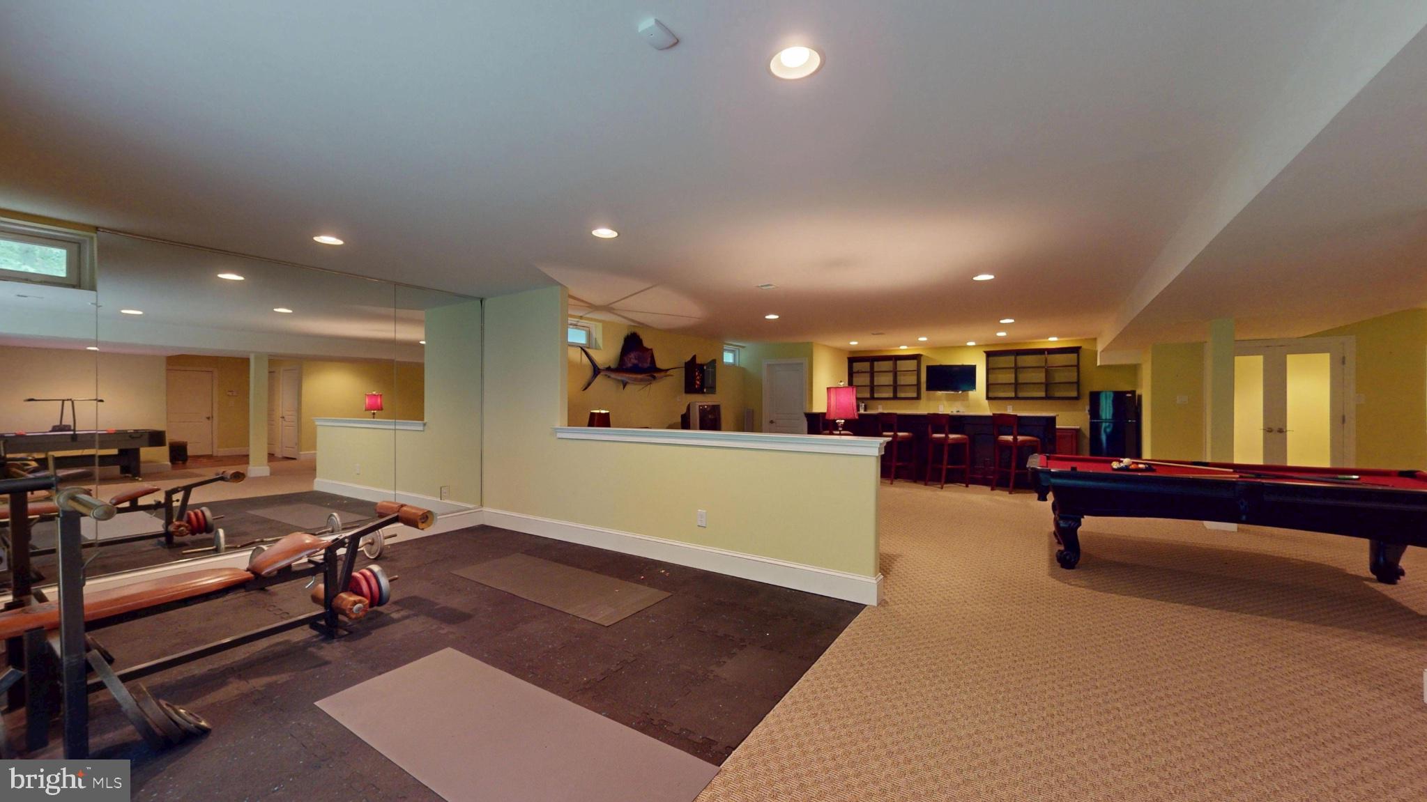309 Ark Road Mount Laurel, NJ 08054 - Photo 50 of 60 a living room with furniture a pool table and a flat screen tv