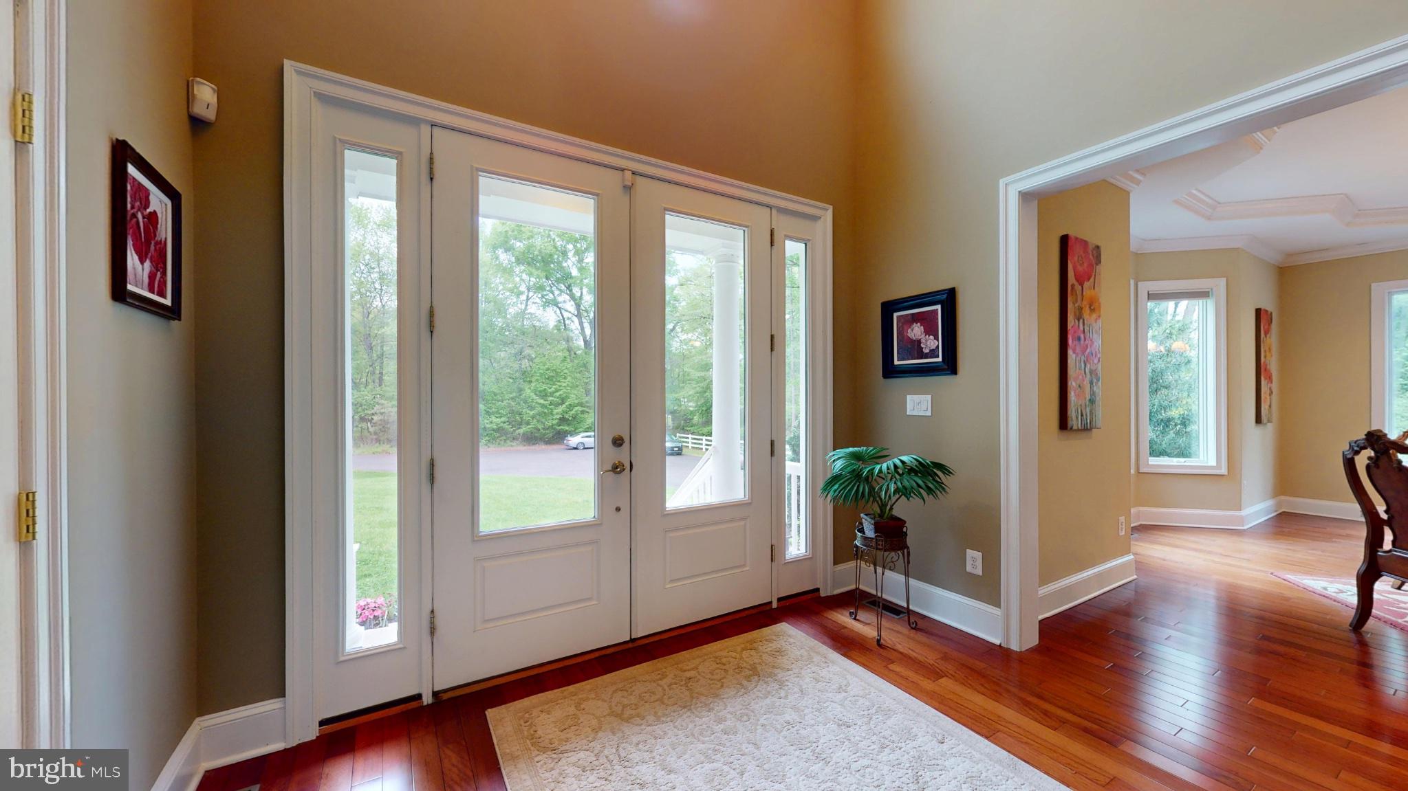 309 Ark Road Mount Laurel, NJ 08054 - Photo 6 of 60 a view of an entryway with wooden floor and windows