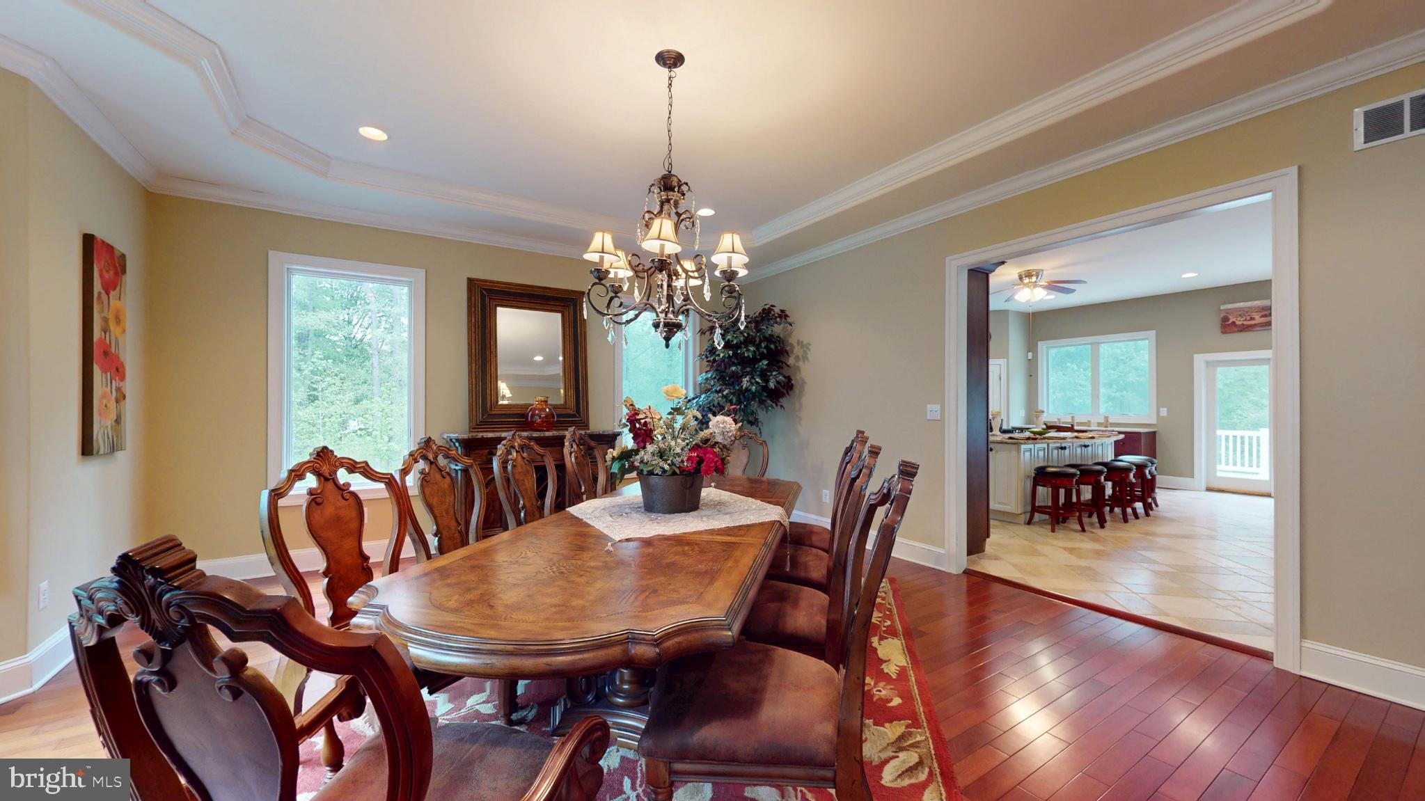 309 Ark Road Mount Laurel, NJ 08054 - Photo 7 of 60 a dining room with furniture potted plants and wooden floor