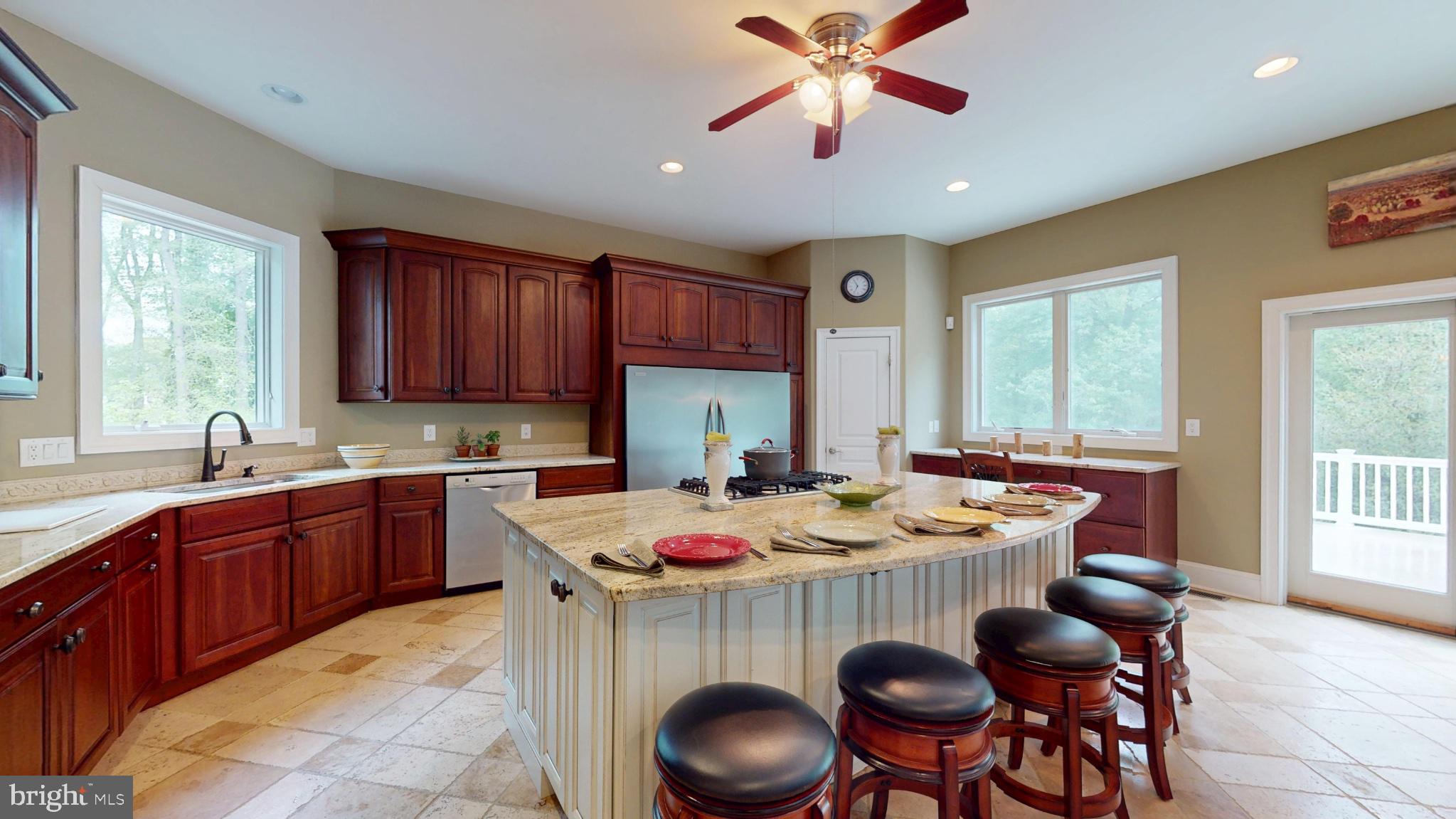 309 Ark Road Mount Laurel, NJ 08054 - Photo 9 of 60 a kitchen with a stove a sink a dining table and chairs