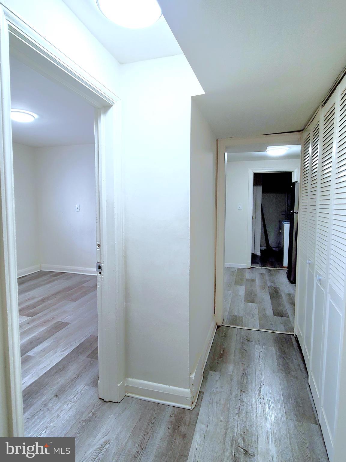 8520 Chestnut Oak Road Parkville, MD 21234 - Photo 21 of 28 a view of a hallway with wooden floor