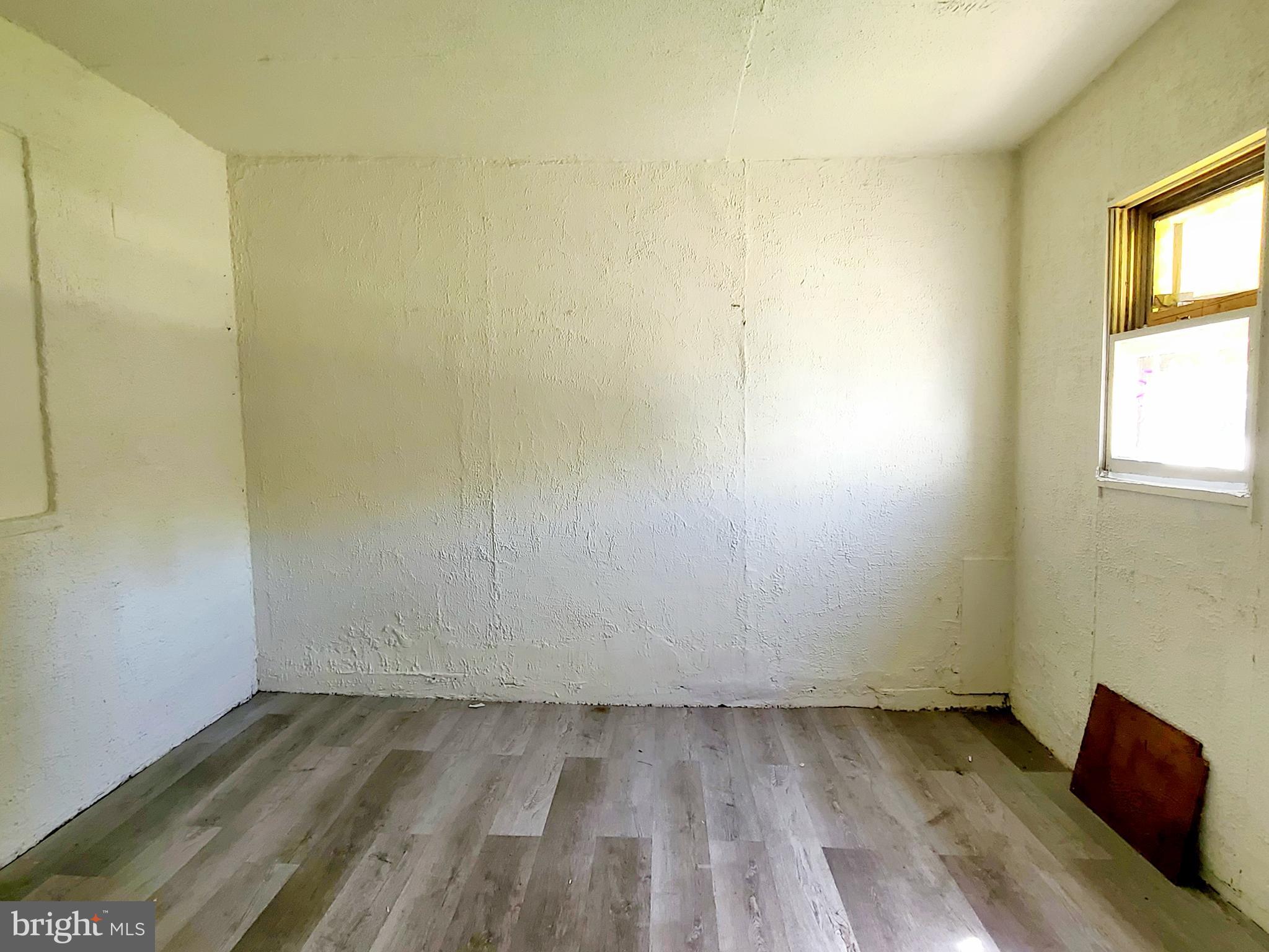 8520 Chestnut Oak Road Parkville, MD 21234 - Photo 27 of 28 a view of a room with wooden floor and a window