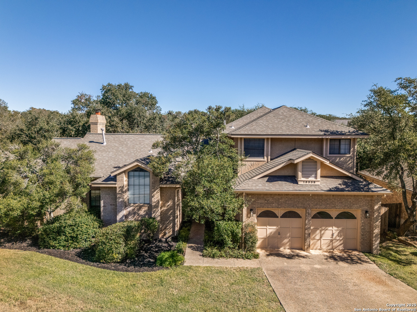 15558 Clover Ridge San Antonio, TX 78248 - Photo 1 of 29 a front view of a house with a yard