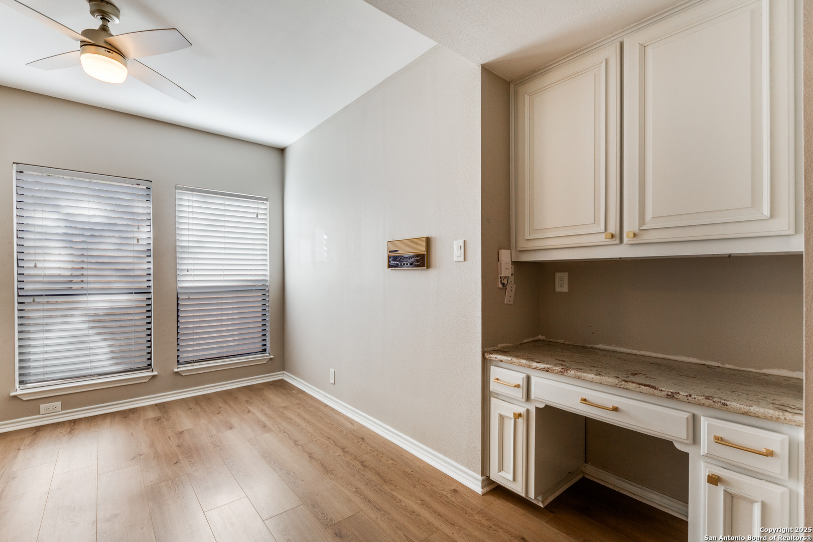 15558 Clover Ridge San Antonio, TX 78248 - Photo 14 of 29 an empty room with wooden floor and window