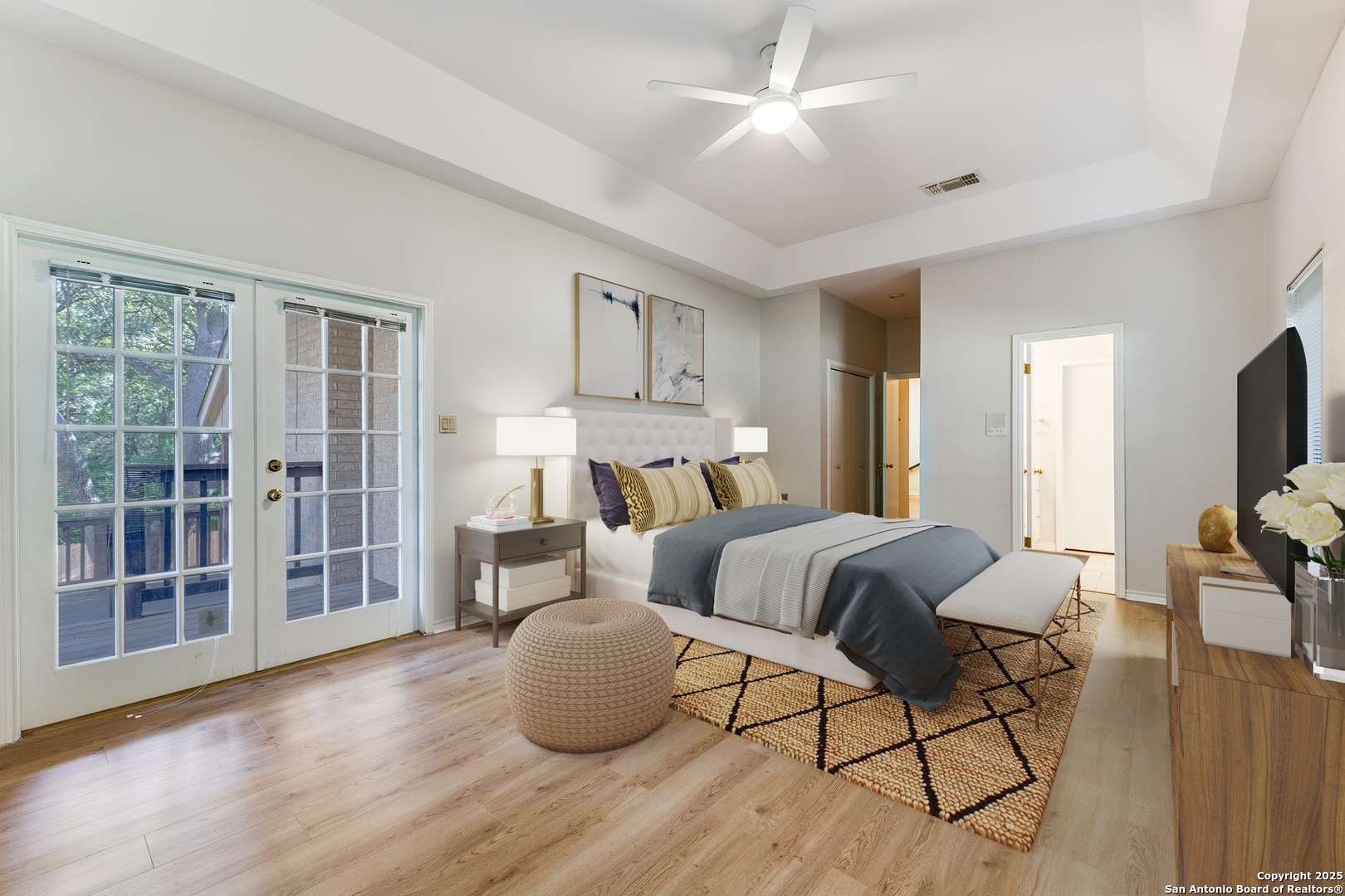 15558 Clover Ridge San Antonio, TX 78248 - Photo 15 of 29 a spacious bedroom with a bed and wooden floor