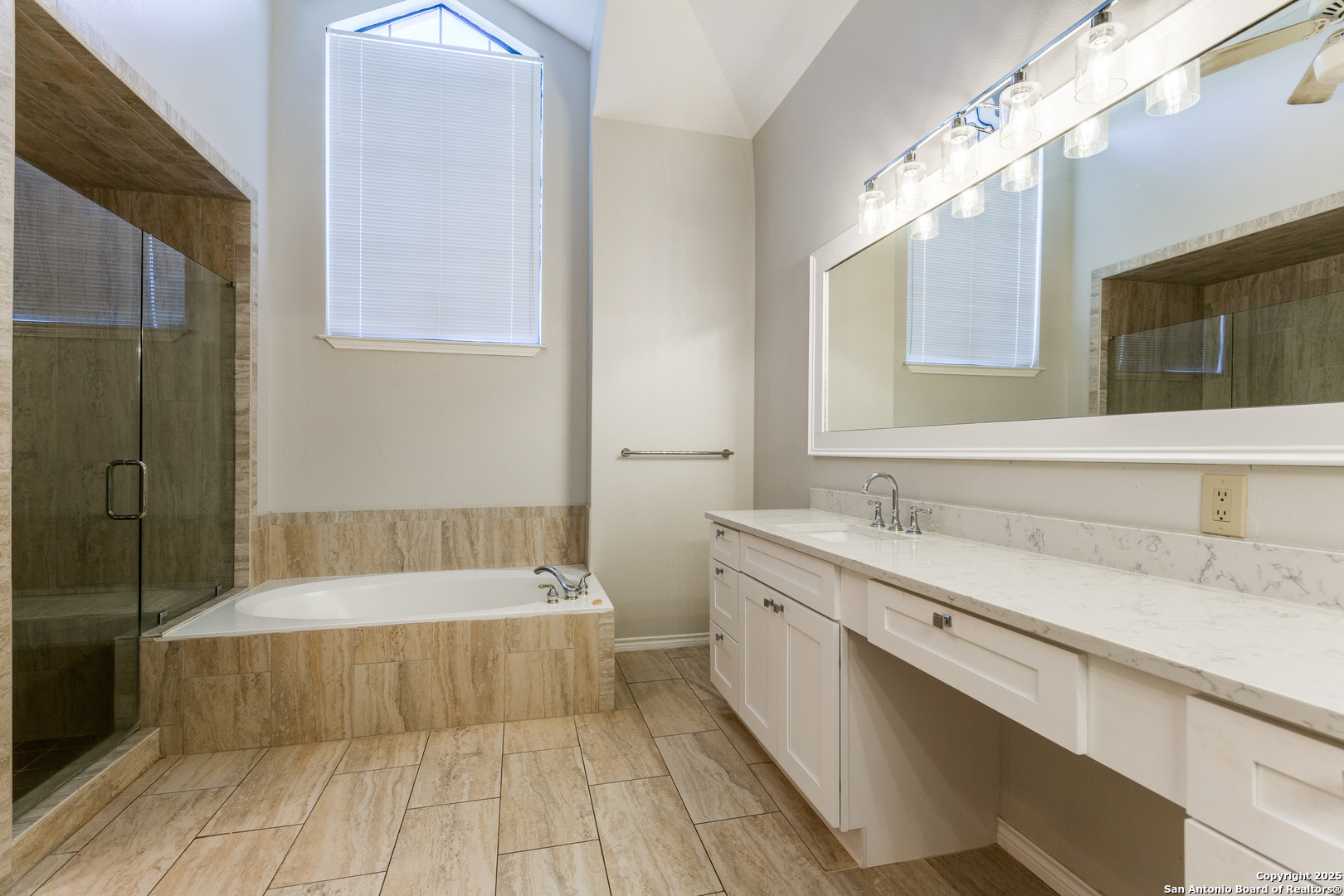 15558 Clover Ridge San Antonio, TX 78248 - Photo 19 of 29 a bathroom with a tub sink and mirror