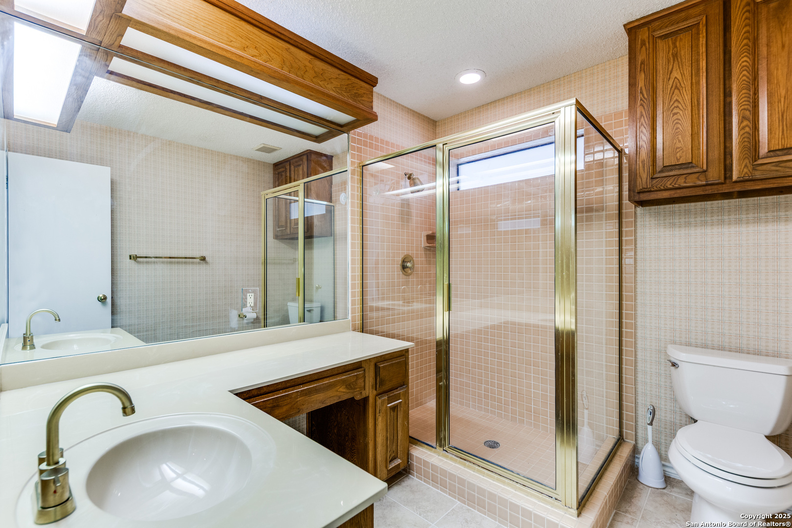 15558 Clover Ridge San Antonio, TX 78248 - Photo 22 of 29 a bathroom with a sink a toilet and shower