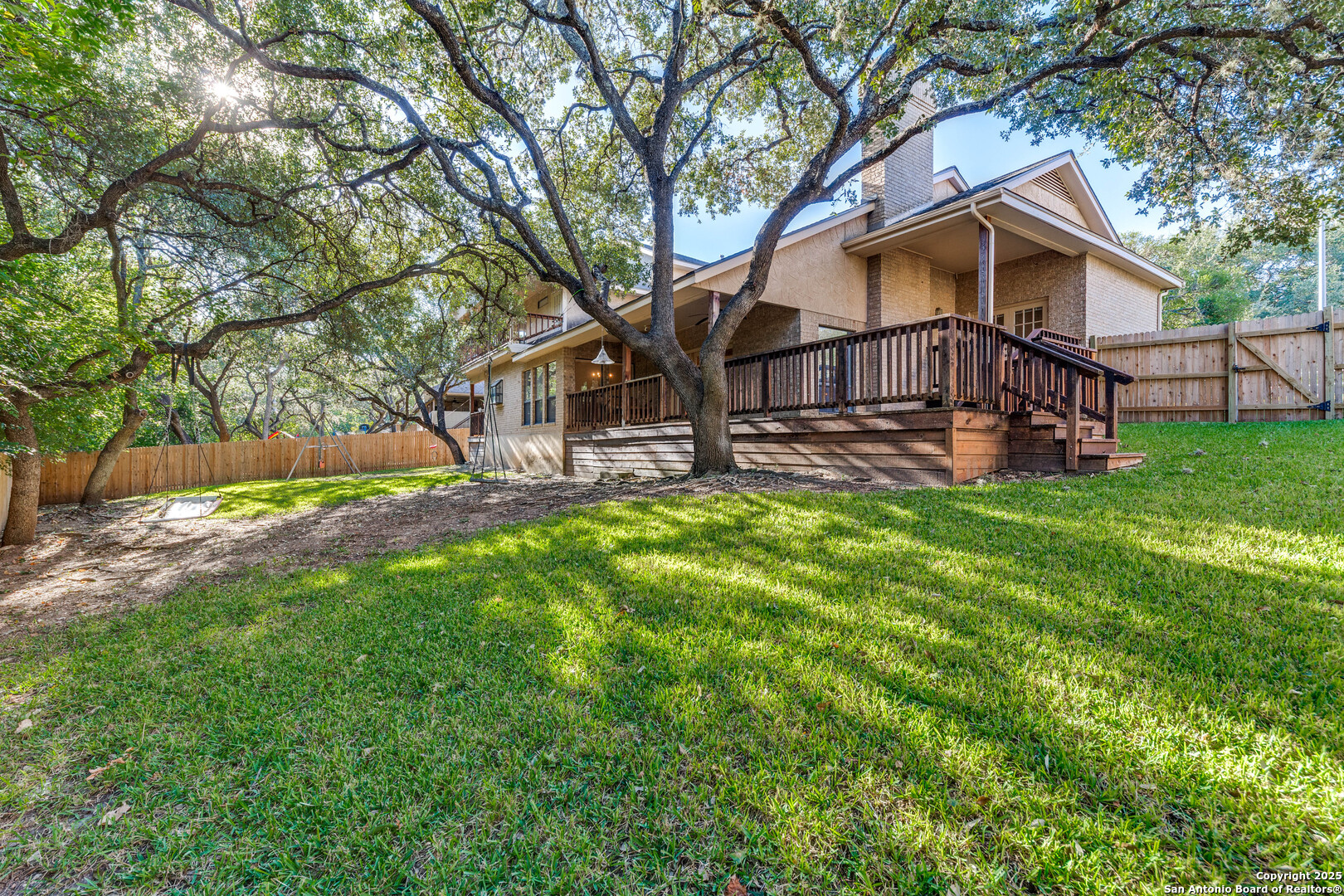 15558 Clover Ridge San Antonio, TX 78248 - Photo 24 of 29 a view of a house with a yard