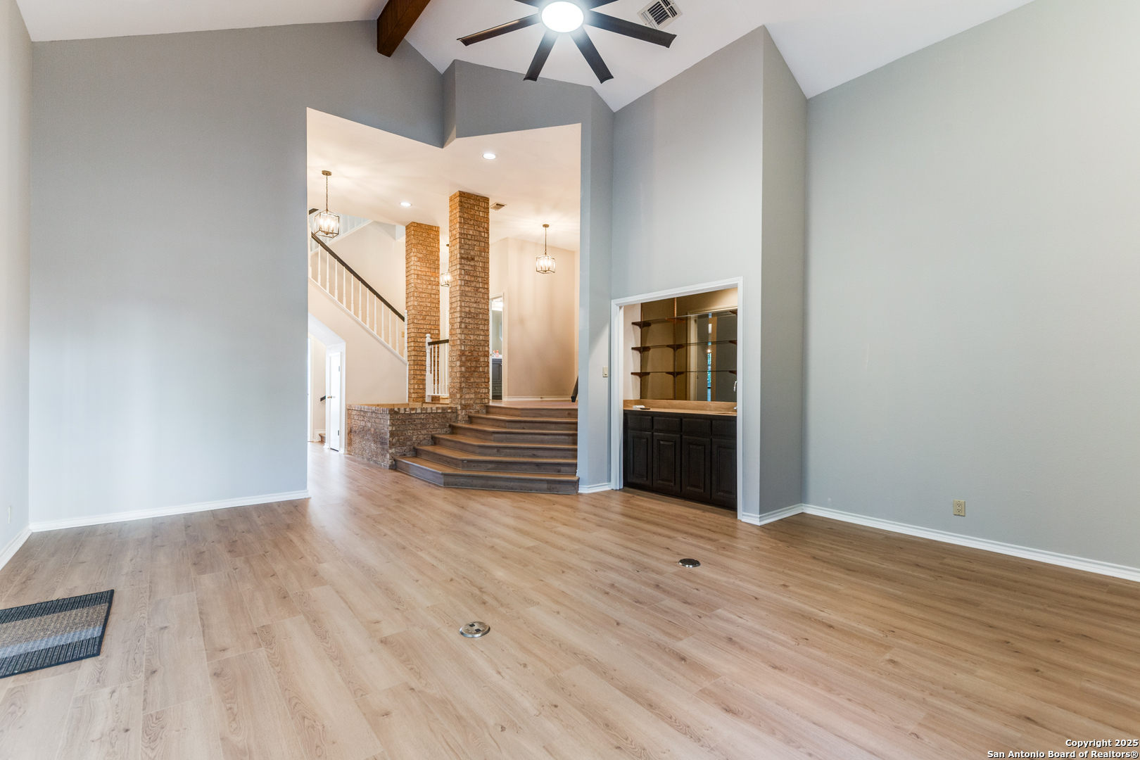 15558 Clover Ridge San Antonio, TX 78248 - Photo 6 of 29 a view of a room with wooden floor ceiling fan and windows