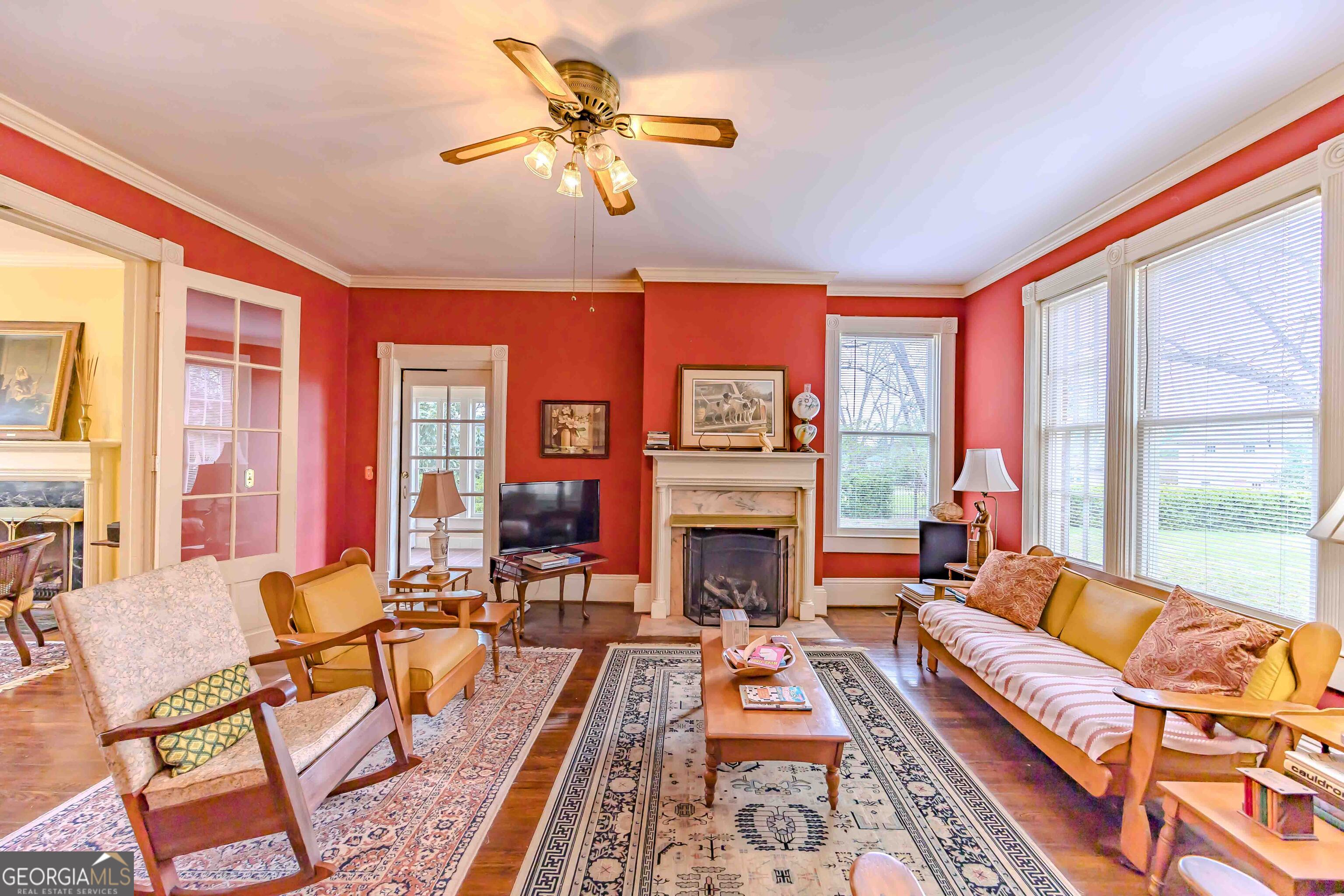 39 West Graham Street McRae-Helena, GA 31055 - Photo 13 of 107 a living room with furniture a fireplace and a large window